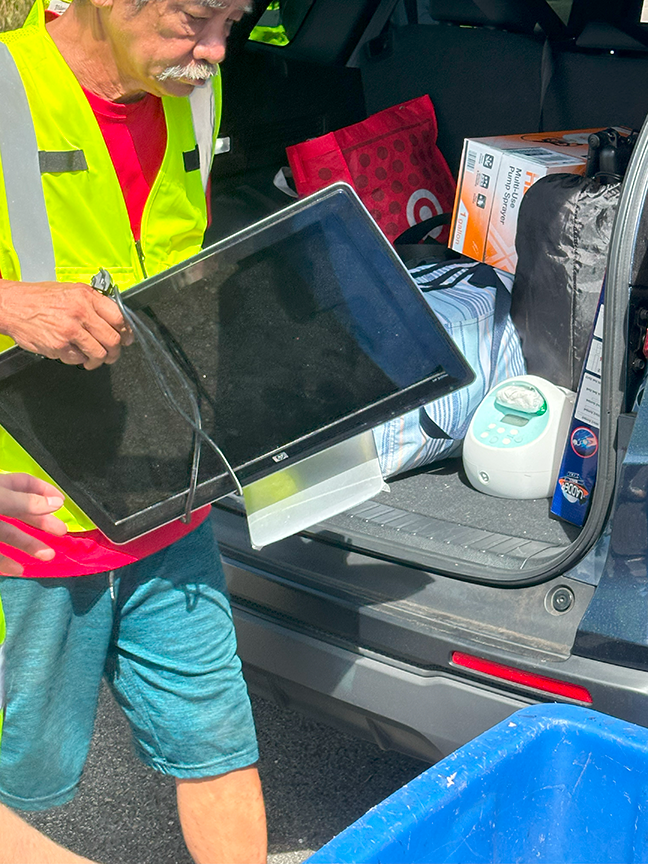 IMG_6333.png man carrying old tv